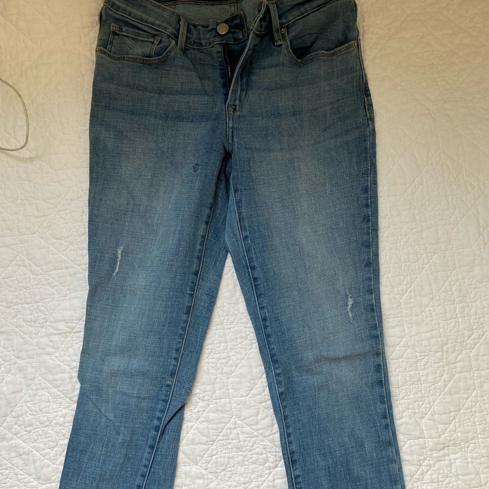Blue mid rise Levi’s jeans